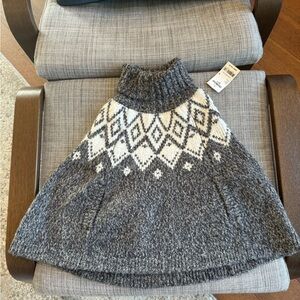 Oshkosh fall poncho sweater for a little girl. New with tags. Size 4US